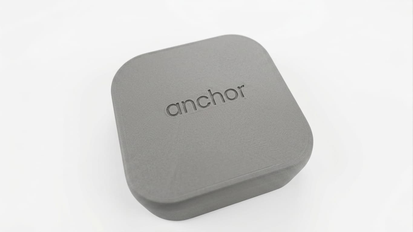 A small physical device called Anchor held between thumb and forefinger